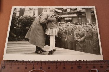 Photo - A. Hitler is hugged by a little girl - Vienna