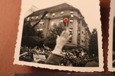 Preview: two snapshots including negatives - Adolf Hitler drives through town - 1936 - Olympic flag