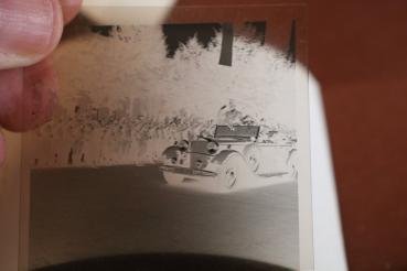 Preview: two snapshots including negatives - Adolf Hitler drives through town - 1936 - Olympic flag