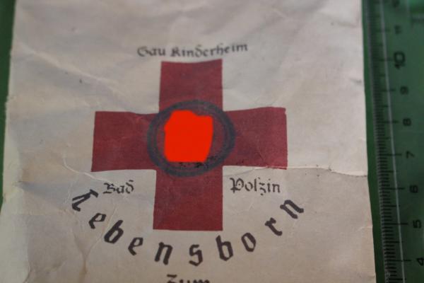 Tüte mit Inhalt - Lebensborn Rot Kreuz mit SS-Runen