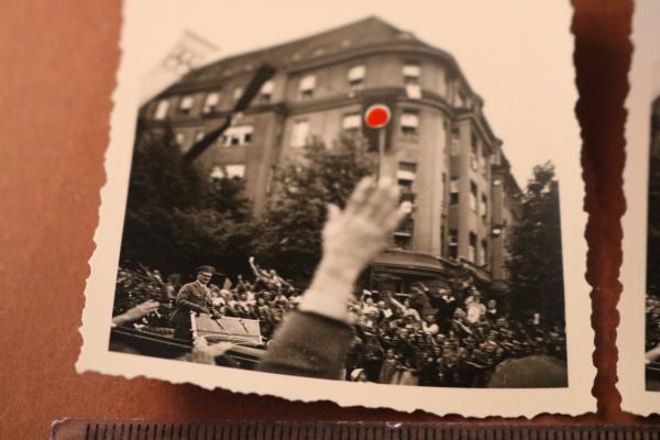 two snapshots including negatives - Adolf Hitler drives through town - 1936 - Olympic flag