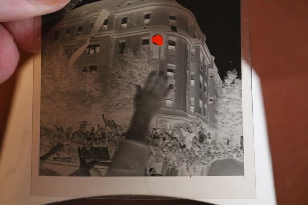 two snapshots including negatives - Adolf Hitler drives through town - 1936 - Olympic flag